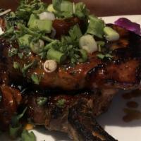 Bourbon Chops · 2 pieces. 8 oz chargrilled French cut pork chops finished with bourbon glaze garnished with ...