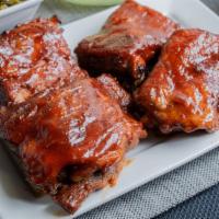 Pork Rib Tips (2 Pieces) · Our sweet and smokey pork rib tips are baked for hours until tender in our house BBQ seasoni...