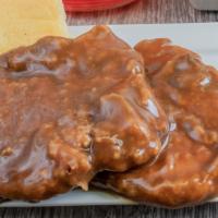 Smothered Pork Chop (1 Piece) · Fried golden brown and delicious pork chops in our special house recipe flour breading mix, ...