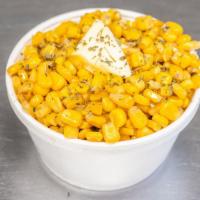 Buttered Corn · Sweet yellow corn off the cob simmered with butter and a dash of salt.