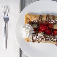 Nutella Strawberry Crêpes · Two delicious crêpes filled with chocolate nutella and fresh strawberries.