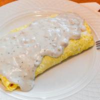 Country Omelette · Sausage, cheese, onions, green pepper, hash browns, mixed together and topped with sausage g...