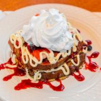 Stuffed Strawberry Cheesecake French Toast · Stuffed with fresh strawberries, topped with cream cheese icing and powdered sugar, served w...
