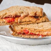 Strawberry Lovers · A thick layer of our fresh, crunchy, honey roasted peanut butter, spread with a layer of str...