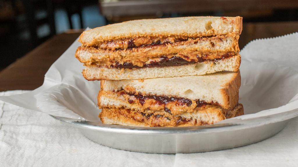 Double Decker · Two layers of fresh Peanut Butter, and two layers of jelly or jam between THREE layers of our traditional bread. Plain or toasted.