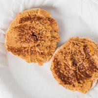 Bagel Pb · A sliced, toasted bagel topped with Peanut Butter, drizzled with honey, and sprinkled with c...