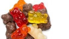 Milk Chocolate Gummi Bears · Gummi bear mix includes a milk chocolate covered assortment of orange, strawberry-banana, cherry, strawberry, marshmallow, and apricot gummi bears. Choose a half pound or one pound package.