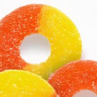 Peach Rings · Gummi Peach Rings are bursting with bright, fresh peach flavor and a light coating of sweet ...