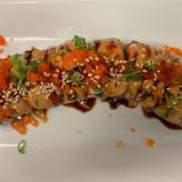 Cherry Blossom Roll · Inside is spicy tuna, jalapenos and cilantro, topped with tuna & avocado. Drizzled with masa...