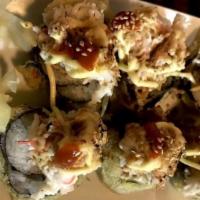 Volcano Roll · Inside cooked shrimp, crab stick and cream cheese, avocado, topped with crab salad then torc...