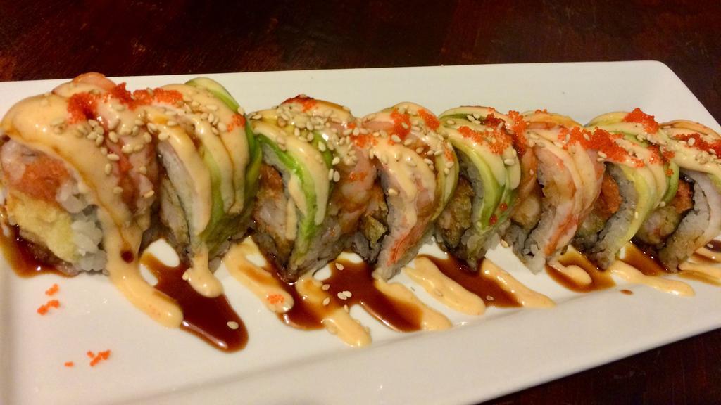 Pink Roll · Inside spicy tuna & fried shrimp, topped with cooked shrimp & avocado, drizzled with masago (smelt eggs), teriyaki & yummy sauce.