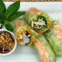 Spring Rolls · Fresh lettuce, mint, cilantro, carrots, and vermicelli noodles wrapped in rice paper. . Spri...