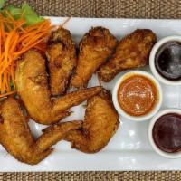 Chicken Wings · Six pieces lightly battered and deep fried to perfection: choose sweet & sour, chili or red ...