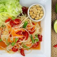 Papaya Salad · Green shredded papaya salad served Thai or Lao style: Thai - Sweet and light with peanuts, C...