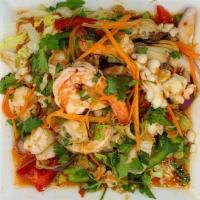 Seafood Salad · Shrimp, squid, scallops and mussels mixed with cucumber, carrots, onions, bell pepper, lemon...