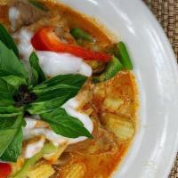 Red Curry · Red curry paste, baby corn, bell peppers, bamboo shoots, basil and coconut milk served with ...