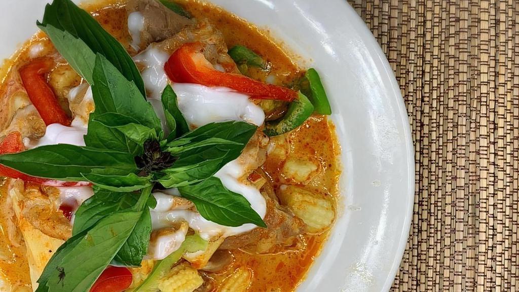 Red Curry · Red curry paste, baby corn, bell peppers, bamboo shoots, basil and coconut milk served with rice. . Can be made GF or V upon request.