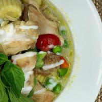 Green Curry · Green curry paste, baby corn, bell peppers, sweet peas, bails and coconut milk served with r...
