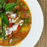 Duck Curry · Roast duck with pineapple, bell peppers, tomato, sweet peas, basil and coconut milk served w...