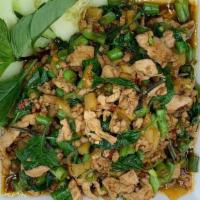 Pad Krapow · Stir-fried holy basil, garlic, bamboo, and Thai chilies with your choice of minced meat serv...