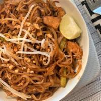 Pad Thai · Sautéed rice noodles cooked with pad thai sauce, bean sprouts, eggs, and green onions topped...