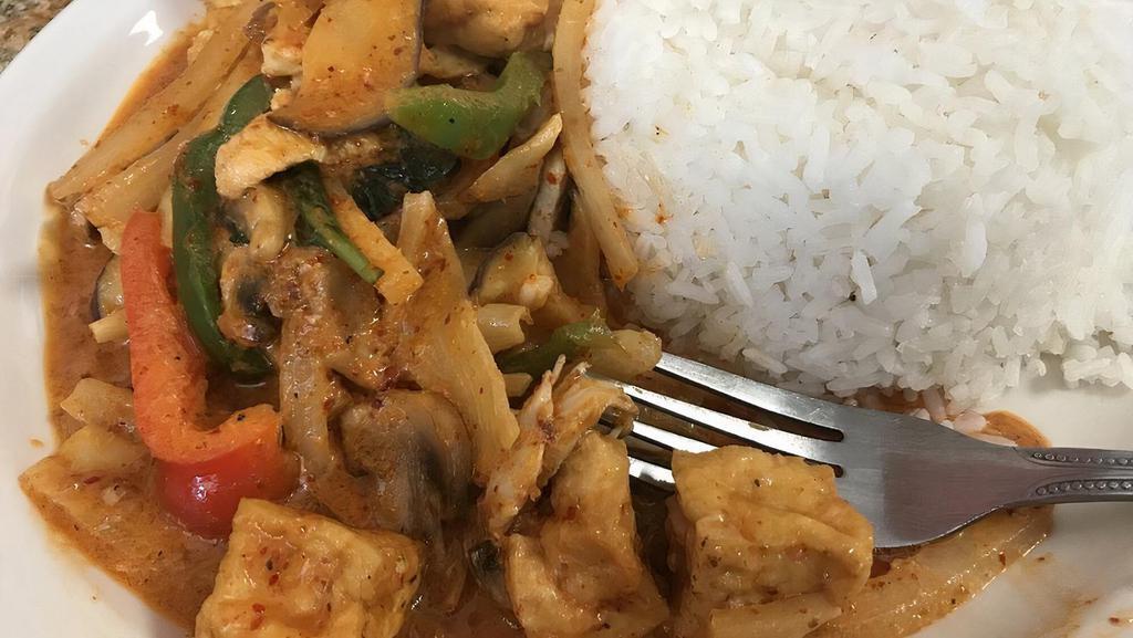 Pad Ped Red Curry · Bamboo shoots, eggplant, onions, and bell peppers simmered in red curry and coconut milk.