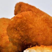 Jalapeno Poppers · Cream cheese-filled peppers battered and fried.