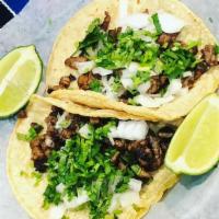 Street Tacos · Three corn tortilla with steak, onions, cilantro and tomatillo sauce. Served with rice and b...