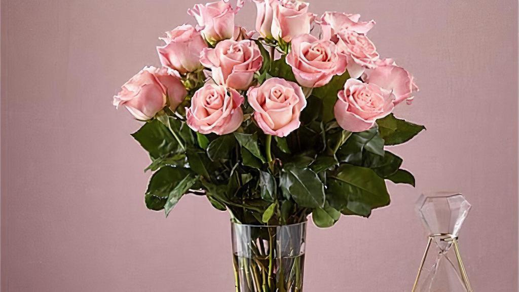 18 Long Stem Pink Roses · Enjoy the classic beauty of the rose with a playful twist in our Long Stem Pink Rose Bouquet. This arrangement features 18 pink roses that will look especially pretty in the hands of those you cherish most. Vase included. Item # E5440D