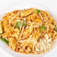 Pad Thai · Thin rice noodies wok-tossed with eggs, green onions and bean sprouts topped with crushed pe...