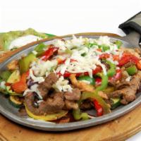 Flaming Cheese Fajitas · Grilled strips of chicken and Steak mixed with red, green and yellow peppers, zucchini, squa...