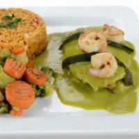 Pescado Poblano · Savory grilled fish filet, filled with cheese and grilled shrimps, topped with our grandma's...