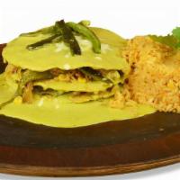 Pastel Azteca (Mexican Lasagna) · Layers of deep fried corn tortilla covered with shredded chicken roasted poblano peppers, on...