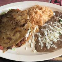 Gordita Dinner · Extra large thick deep fried corn tortilla stuffed with your meat or vegetable choice, lettu...
