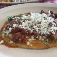 Huarache Dinner · Extra thick large grilled corn tortilla topped with your choice of meat or vegetable, beans,...