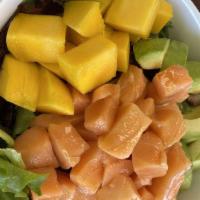 Salmon Poke Bowl · sushi rice, spring mix, salmon, seaweed salad, mango, avocado, cucumber, jalapeno, lemon and...