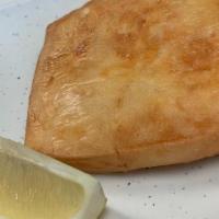 Saganaki · Unbelievably delicious fried Kefalotyri cheese. We suggest you squeeze a bit of lemon on top...
