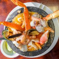 Molcajete San Blas · Shrimp, octopus, scallops, surimi, crab legs, mussels, and clams. Sautéed in a delicious hot...