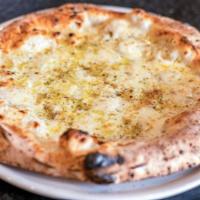Garlic Cheese Bread · Our pillowy dough with mozzarella, oregano, and shaved garlic. Served with our house made or...