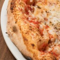 Veganeese · It’s a cheese pizza with vegan mozzarella