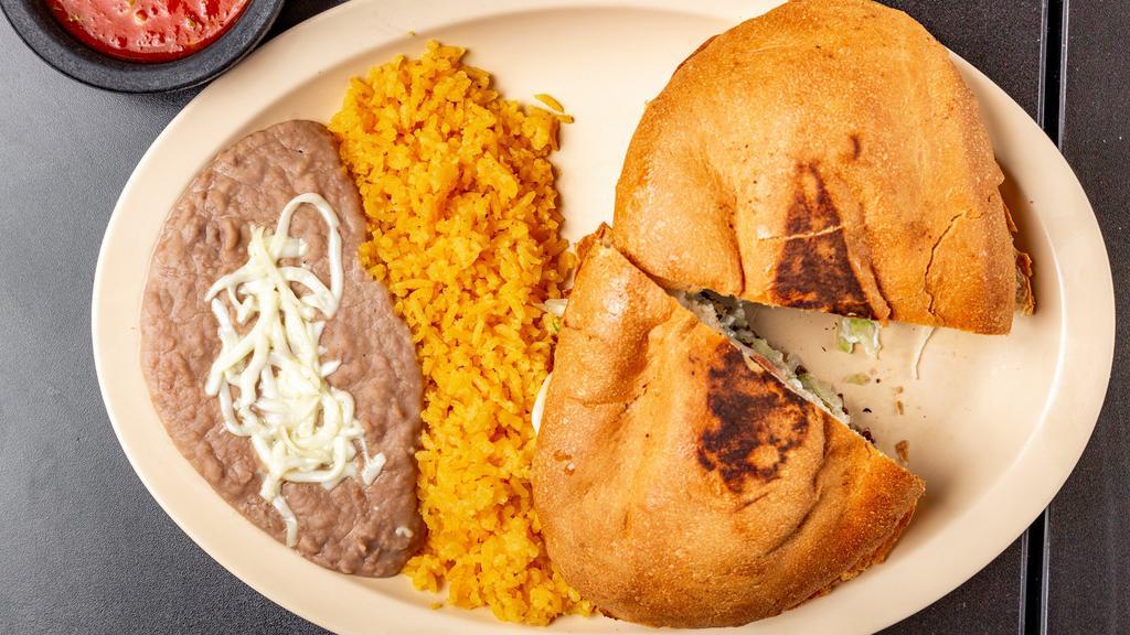 Torta Plate · Includes beans, cheese, lettuce, tomatoes, and sour cream.