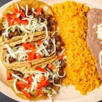 Taco Dinner · 3 tacos with lettuce, tomatoes, cheese, and your choice of meat. Served with a side of rice ...