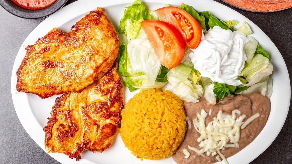 Pechuga En La Plancha Dinner · Grilled chicken breast with lettuce, tomatoes, avocado, and tortillas, corn or flour. Served with a side of rice and beans.