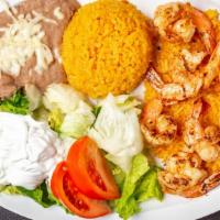 Camarones A La Diabla Dinner · Grilled shrimp covered with a spicy sauce, served with lettuce, tomatoes, avocado, and torti...