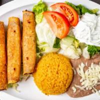 Flautas Dinner · 3 flute shaped tacos filled with chicken, served with lettuce, tomatoes, sour cream, and gua...
