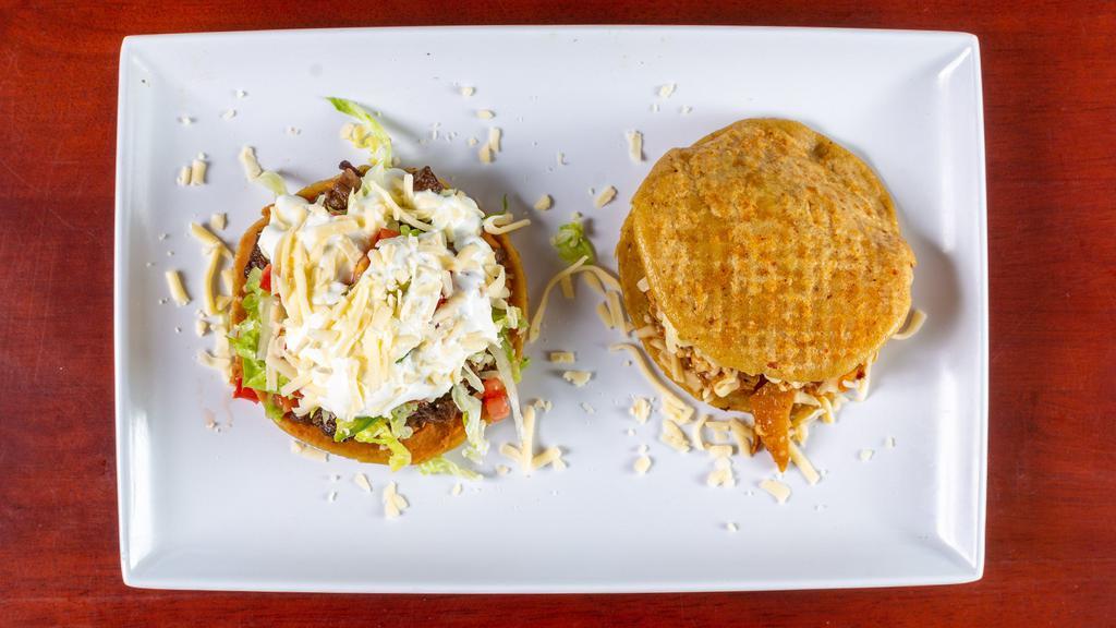 Gordita · Served with lettuce, tomato, sour cream, and cheese
