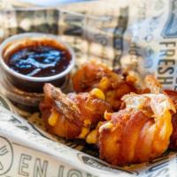 Bacon Bombs · Gluten Free. Jumbo shrimp stuffed with cheese, wrapped in thick cut bacon and fried crispy w...