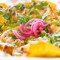 Nachos · Choice of chicken or beef, loaded with cheese, drizzled sour cream sauce & guacamole sauce.