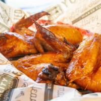 Chicken Wings · Whole wings fried crispy and sold by the pound. Choice of Spicy Jerk BBQ, Lemon Pepper or Bu...