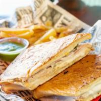 “El Jefe Cubano” Cuban Sandwich · Cuban bread pressed hot on the “Plancha” with herb-crusted pork, ham, fresh pickles, mustard...